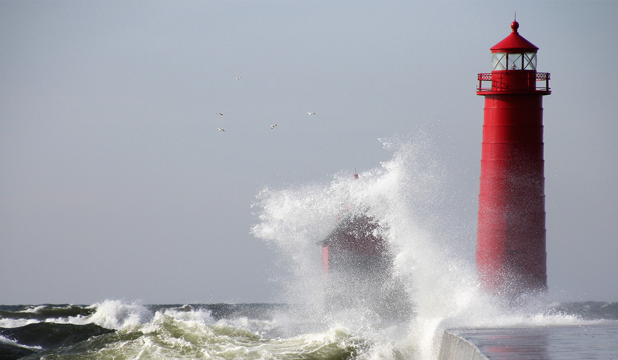 thumbnail image of waves crashing against a pier in Grand Haven, Michigan